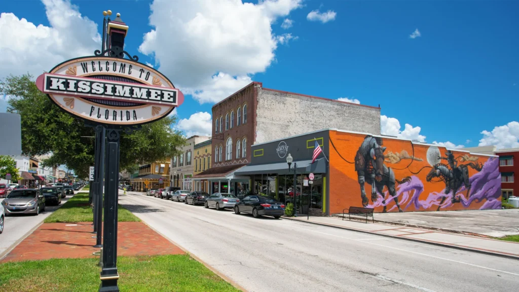 Downtown Kissimmee, FL street with a welcome sign and brick storefronts
